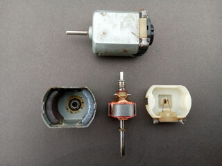 parts of dc motor, armature, brushes, permanent magnets and commutator - obrazy, fototapety, plakaty
