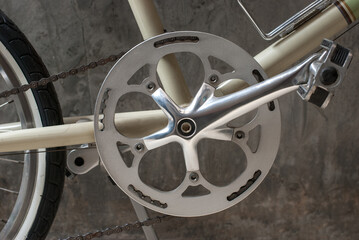 A bicycle crankset, chainring, and chainring guard close up view.
