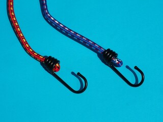 Bungee cord set with fixing hooks. Securing objects in car trunks. Elastic cords and tarp straps 