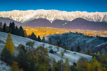 Breathtaking autumn scenery with snowy mountains, Bran, Transylvania, Romania