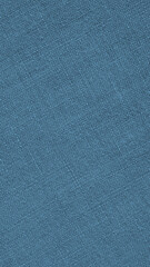 Fototapeta na wymiar Blue woven surface closeup. Linen textile texture. Fabric handicraft background. Textured braided backdrop. Len vertical phone wallpaper. Macro