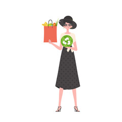 The woman is depicted in full growth and holds a bag of healthy food in her hands and shows the EKO icon.   Flat trendy style.