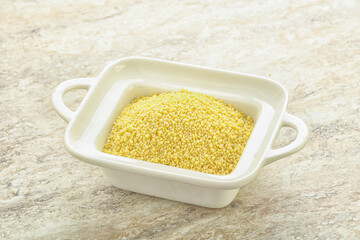 Raw couscous in the bowl