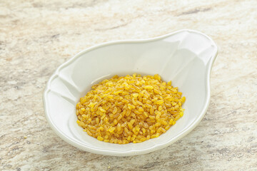 Raw bulgur in the bowl