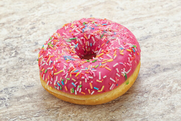 Sweet glazed struwberry donut with icing
