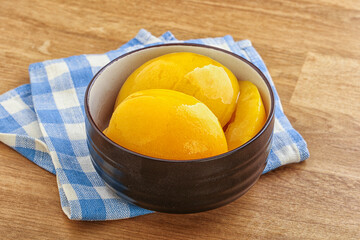 Sweet canned peaches with syrope