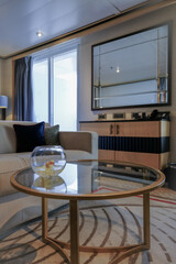 Luxurious ocean view or oceanview or outside or exterior balcony veranda cabin suite on luxury ocean liner cruiseship cruise ship in classic classy Art Deco interior design