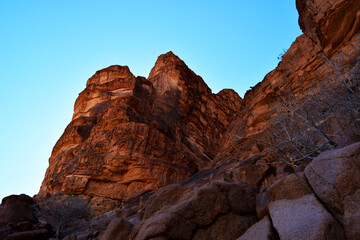 Fototapeta na wymiar Amazing desert landscape. Beautiful landscape of desert mountains. Monolithic mountains in the central part of the desert. Wadi Rum, Jordan.