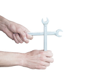 place for text on the background of a wrench in a hand. the banner depicts hands holding tools.hand of the master holds an adjustable wrench