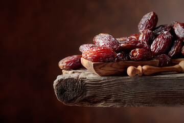 Dried dates on a old wooden table.