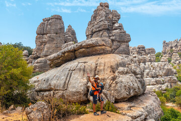 A young father with his son enjoying the Torcal de Antequera on the green and yellow trail, Malaga