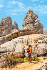 A young father with his son enjoying the Torcal de Antequera on the green and yellow trail, Malaga