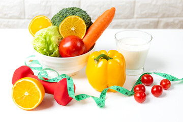 Diet and healthy fresh vegetable for detox body slim fit for health lifestyle with Sport exercise equipment workout and milk. Weight Loss and Diet Concept