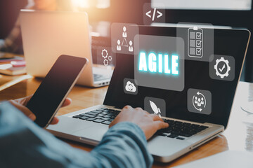 Agile development methodology concept, Woman hand typing keyboard with VR screen Agile icon on...