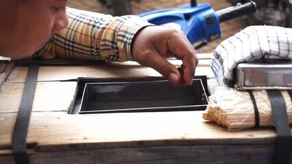 Close up asian man serving traditional Indonesian ice cream snacks to buyers or customers.