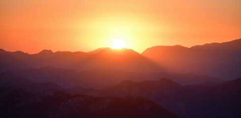 Obraz premium Mountain Silhouettes at Sunset
