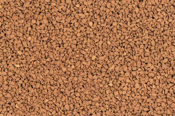Granulated brown coffee background texture close up. instant coffee
