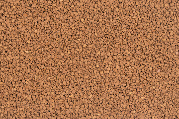 Granulated brown coffee background texture close up. instant coffee