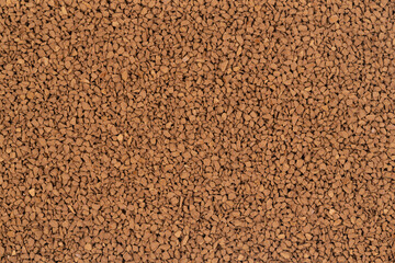 Granulated brown coffee background texture close up. instant coffee
