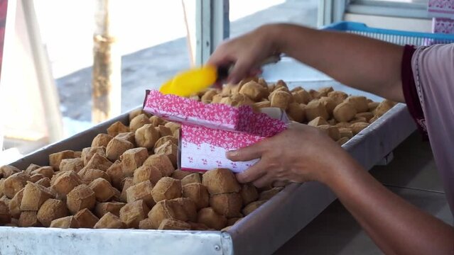 Footage of Popular street food of deep-fried bean curd from Sumedang, West Java. Indonesian traditional food called Tahu Sumedang with green chilies.