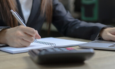 Business woman working on Desk office in finance and accounting Analyze financial budget in the office