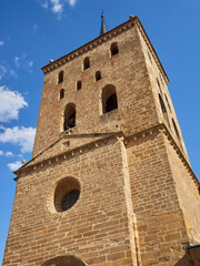 Fototapeta na wymiar Romanesque bell tower with a spire of the church Santa Maria del Azogue, also called La Mayor, in Benavente, Zamora, Castilla y Leon, Spain, Europe