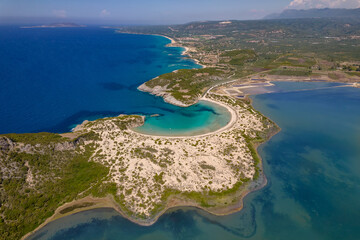 Fototapeta premium Aerial drone photo of the iconic semicircular sandy beach of Voidokoilia in Messinia, Gialova, Peloponnese, Greece