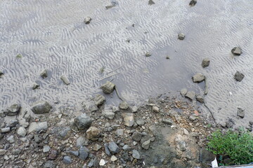 Background of pile of small stones on the sand