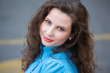 Street photo of a white European girl with a beautiful face.