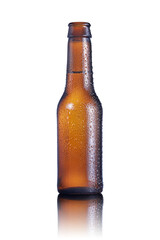 Cold Beer bottle with condensation drops and a semitransparent reflection
