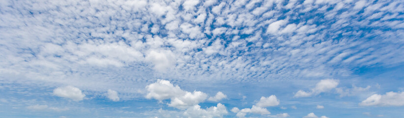 The blue sky and white clouds float in the sky on a clear day with warm sunlight. combined with the cool breeze blowing into the body This results in a wonderfully heavenly freshness.