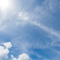 The blue sky and white clouds float in the sky on a clear day with warm sunlight. combined with the cool breeze blowing into the body This results in a wonderfully heavenly freshness.