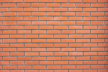 Fototapeta premium Red brick wall texture. Grunge rough brickwork background