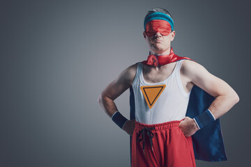 Funny superhero wearing a sleep mask