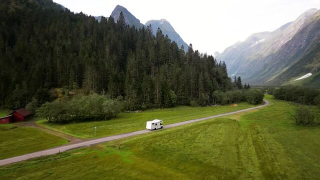 Aerial, drone following motorhome, in beautiful nature Norway.