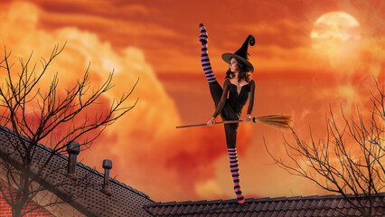 A ballerina in pointe shoes in a black witch costume with a hat and a broom is dancing on the roof of an old house against the backdrop of an ominous bright sunset.