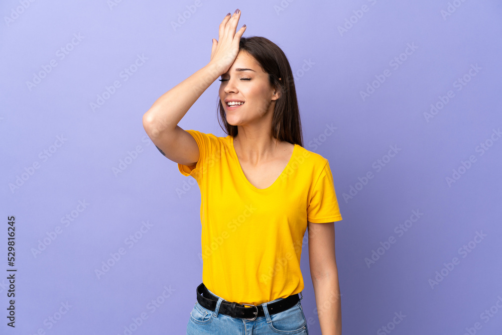 Wall mural Young caucasian woman over isolated background has realized something and intending the solution