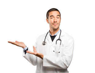 Happy doctor show gesture against white background