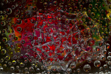 Striped spheres are located against the colorful background with multicolored web silhouette. Space abstraction. 3D render. 