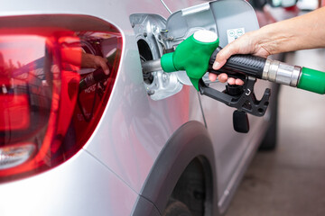 Filling fuel into the car tank at the pump service station, for concept transportation power...