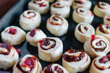 Making yeast buns with jam and chocolate. Handmade homemade cakes.