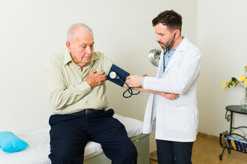 Older man with high blood pressure getting a medical exam
