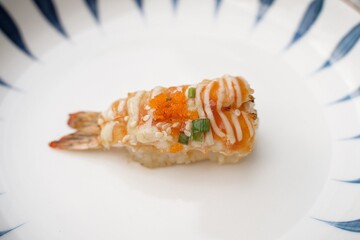 Fire-grilled shrimp sushi is a simple Japanese dish. The seafood is delicious.  sushi restaurant concept