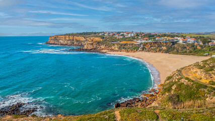 Beautiful landscape of  rocky ocean coastline,  spring.  Aerial view of a small European town against cloudy sky, sandy beach and Atlantic Ocean. Top view  Beautiful natural beauty. Drone photography