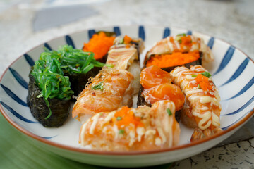 Sushi set with various faces is simple Japanese food. Delicious seafood.  sushi restaurant concept