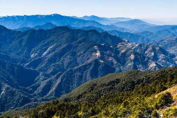 Naklejka premium Layers of magnificent mountains and clear clouds background in the morning. 