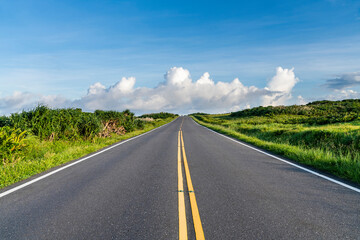 View of the road with blue sky in the countryside of Pingtung, Taiwan.