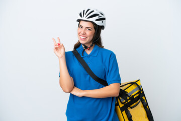 Young delivery woman with thermal backpack isolated on white background smiling and showing victory sign