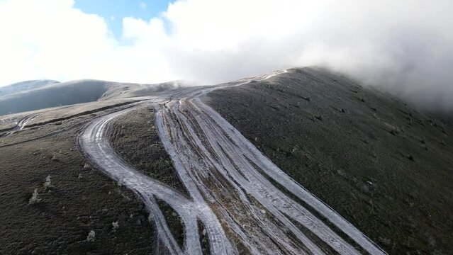 aerial view of travel landmark autumn mountains with snow