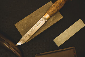 manual sharpening of a knife from high-carbon steel, Damascus Blade